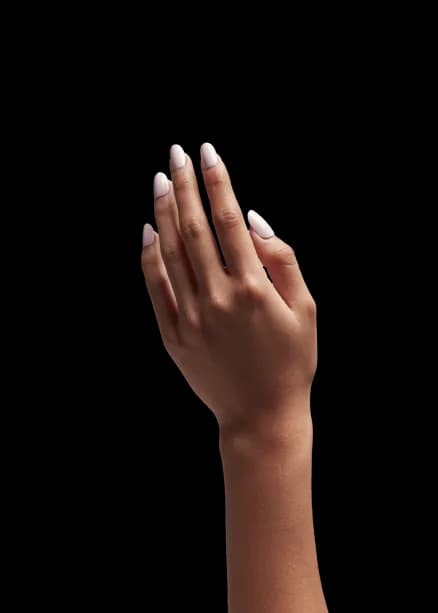 A shopper's hand reaching for a product